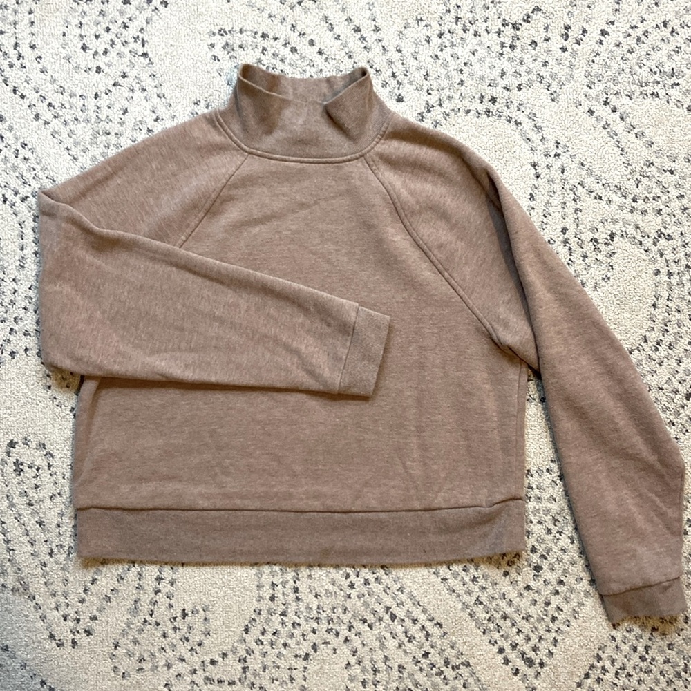 Tan cropped sweatshirt.